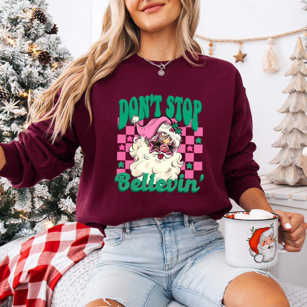 Don't Stop Believin' Pink Santa - Christmas Unisex Crewneck T-Shirt Sweatshirt Hoodie