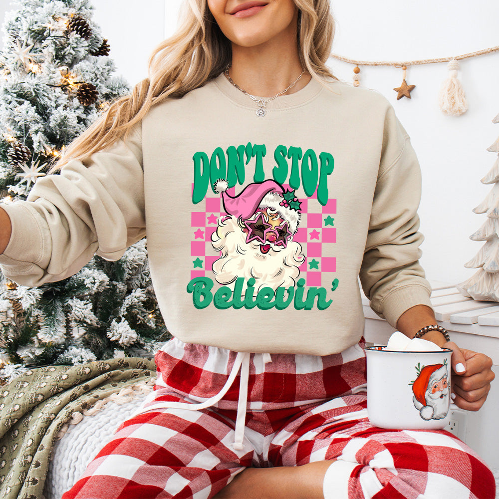 Don't Stop Believin' Pink Santa - Christmas Unisex Crewneck T-Shirt Sweatshirt Hoodie